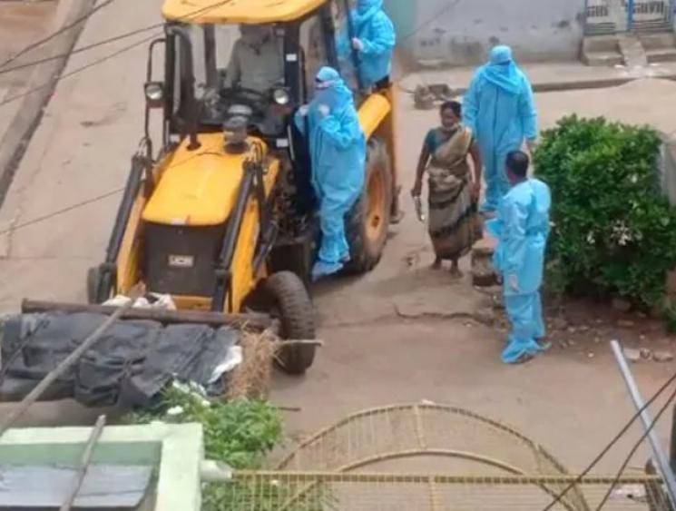 Coronavirus victim's body carried in a JCB to the crematorium in Andhra Pradesh