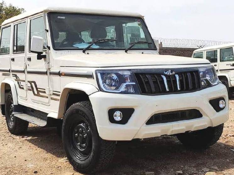 Video: Mahindra Bolero crashes into JCB running without control & saves man's life!