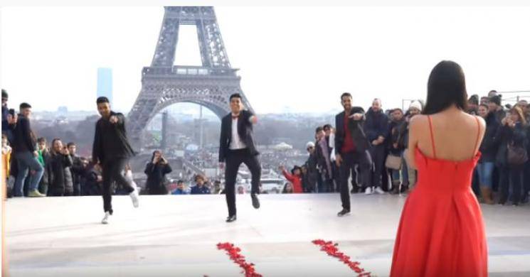 Cinema style love proposal in front of Eiffel Tower