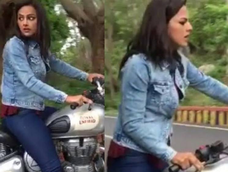 Nerkonda Paarvai actress falls from Royal Enfield bike after losing balance - Watch Video Here!