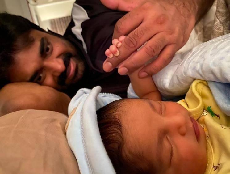 Vijay's adorable cute moment with his newborn son! Check out the sweet picture here!